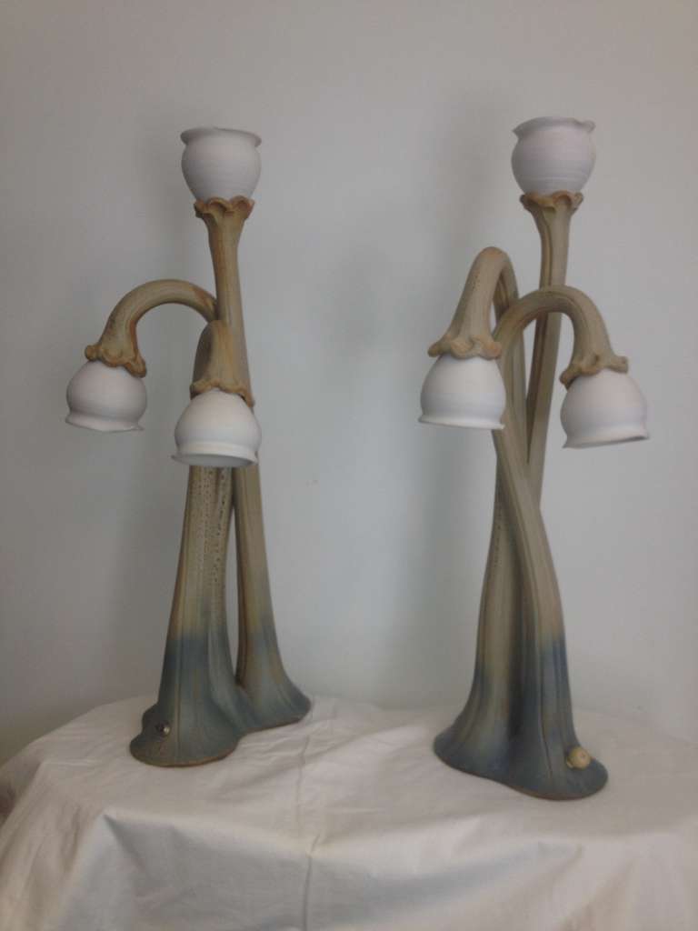 Pair Ceramic Handmade Lilly Lamps wired with three way switches to illuminate 
Different Lights for different modes .all ceramic porcelain pottery.