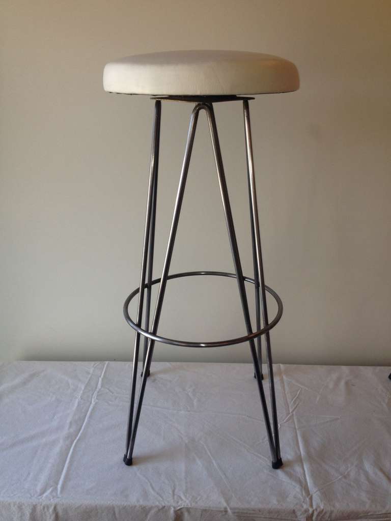Six off white leather top polished steel tower base 1950's bar stools.that swivel