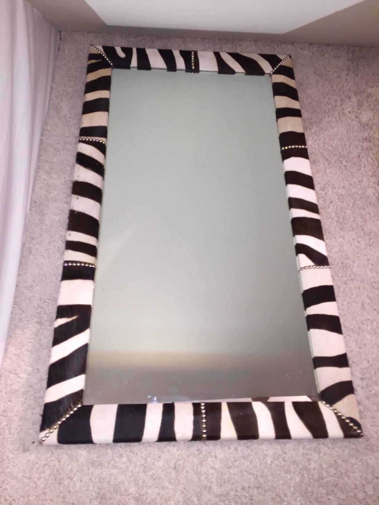 Zebra skin chrome nailhead tall Hollywood Regency mirror.