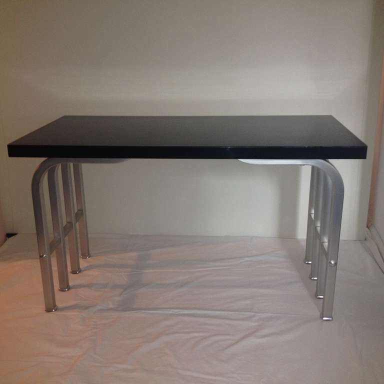 Donald Desky style brushed aluminum and black Bakelite table with hidden adjustable feet to level, rare and unusual , in polished original condition