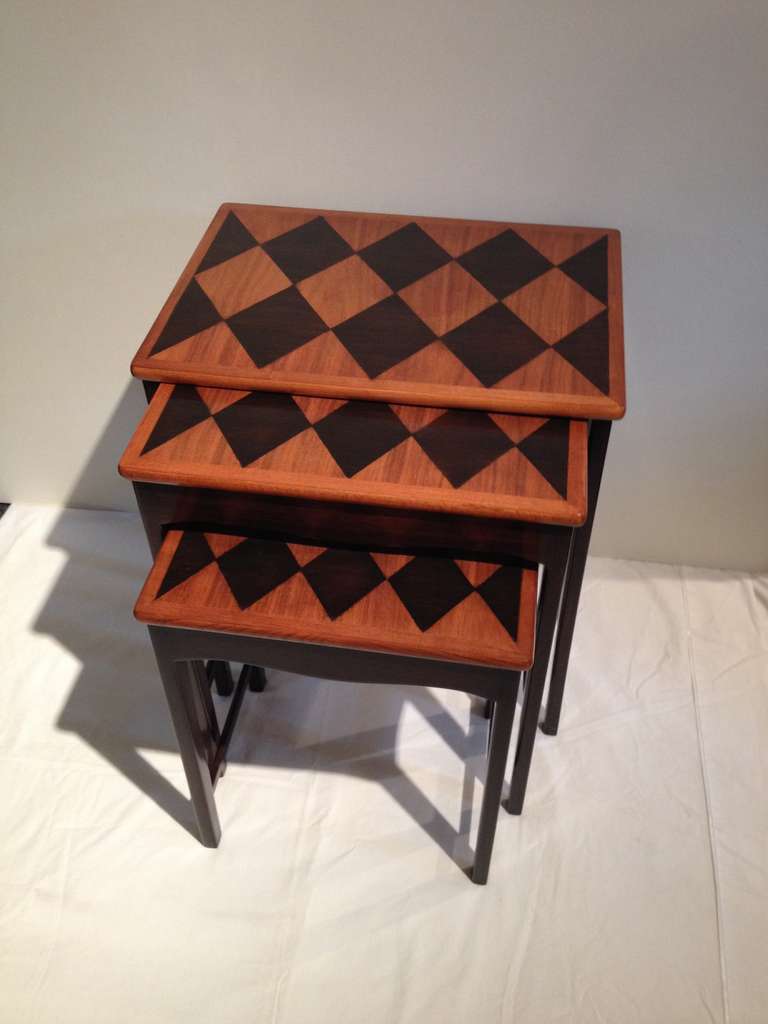 Signed G. Lundberg, Swedish handmade diamond designed marquetry top nesting tables wood appears to be mahogany and dark walnut finish with elegant front aprons.<br />
<br />
small table 14x10.50x17.50 medium 21x12x21 large 19x13.50x21.50