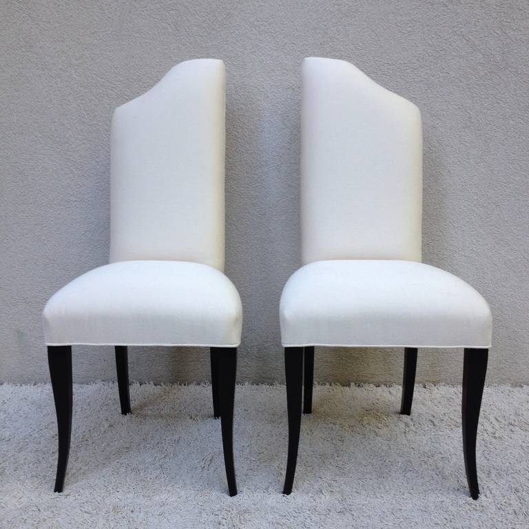 Pair Elegant  Hollywood Regency,high back angled design,off white and Black lacquered leg Side Chairs
