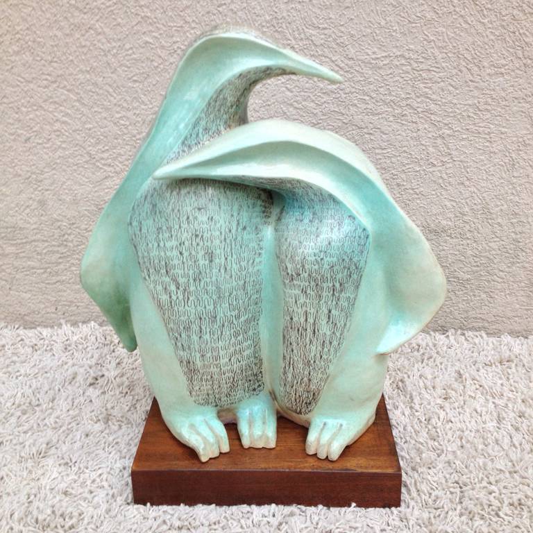 Signed U Herman two Penguin Sculpture Ceramic Light Turqoise and charcoal grey black work,on wooden base ,possibly french?