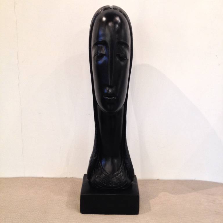 Artist Rima Padova Tall Black Plaster Bust signed and numbered.
  
Rima made unusual abstract jewelry and fine art sculpture for several decades. She studied with the Art Students League, the Pratt Institute, the Museum of Modern Art School, the