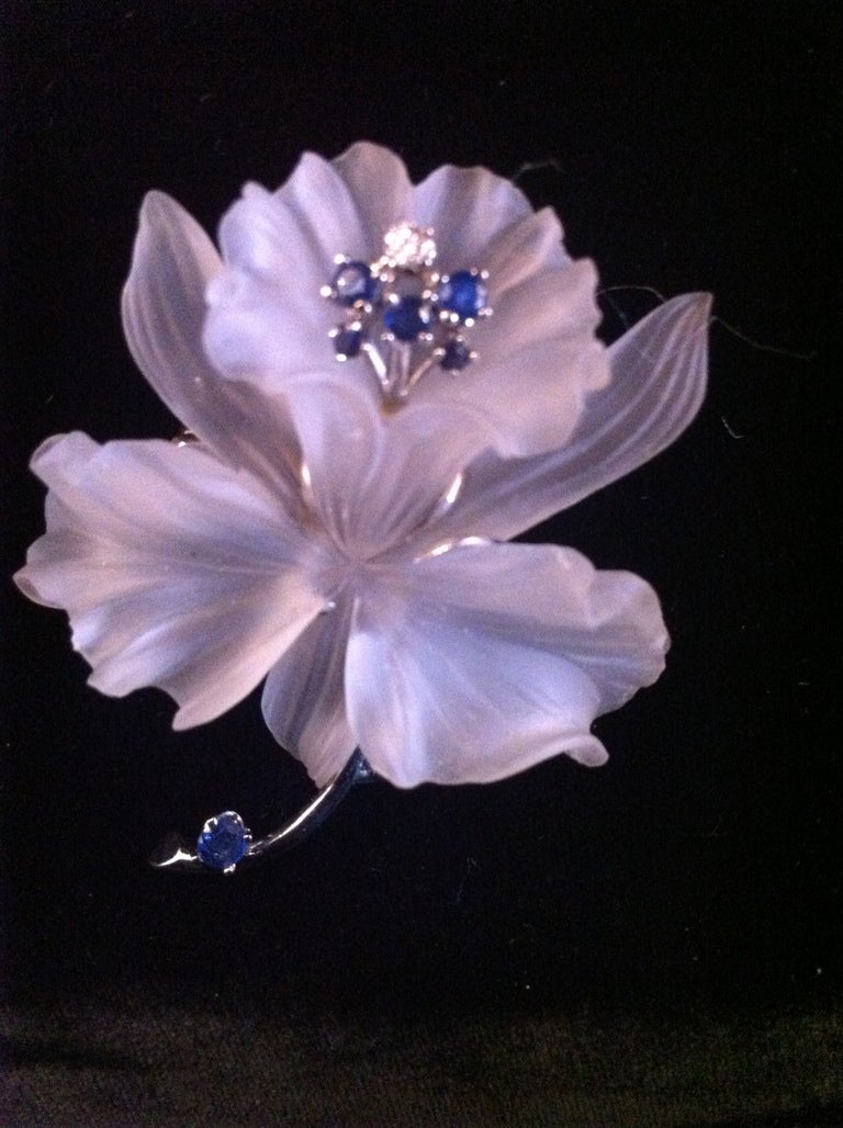 circa 1950's hand carved crystal flower pin set in 14k white gold and with 6 sapphire stone and one diamond with small hallmark after 14k mark illegible 