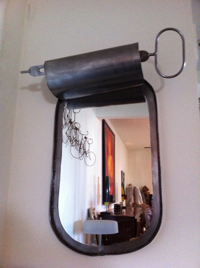 1960's Steel Sardine Can Mirror sculpture ,the top is 31.50 for the turning device.in a gun metal steel finish.
