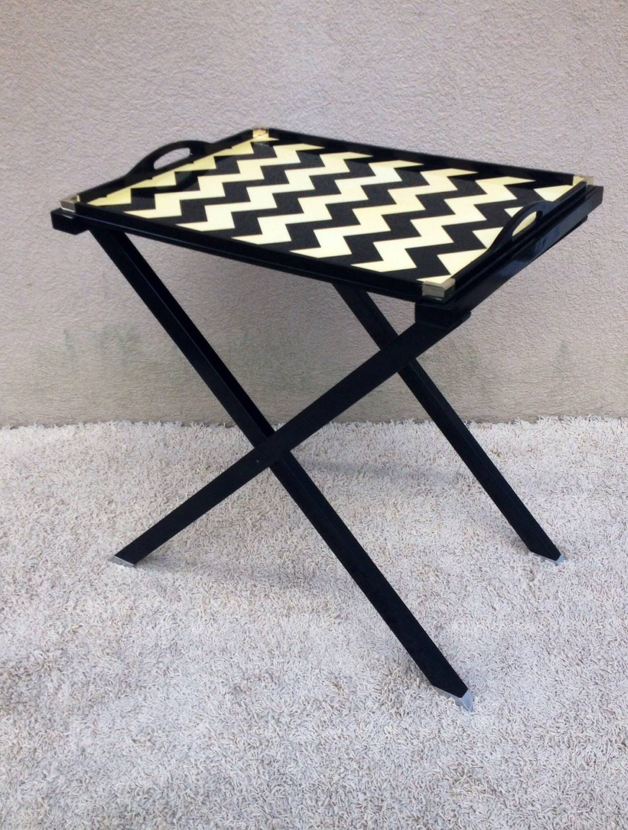 Oscar De La Renta black and crème lacquered tray table with stand, Lunt Silver corners and feet.
