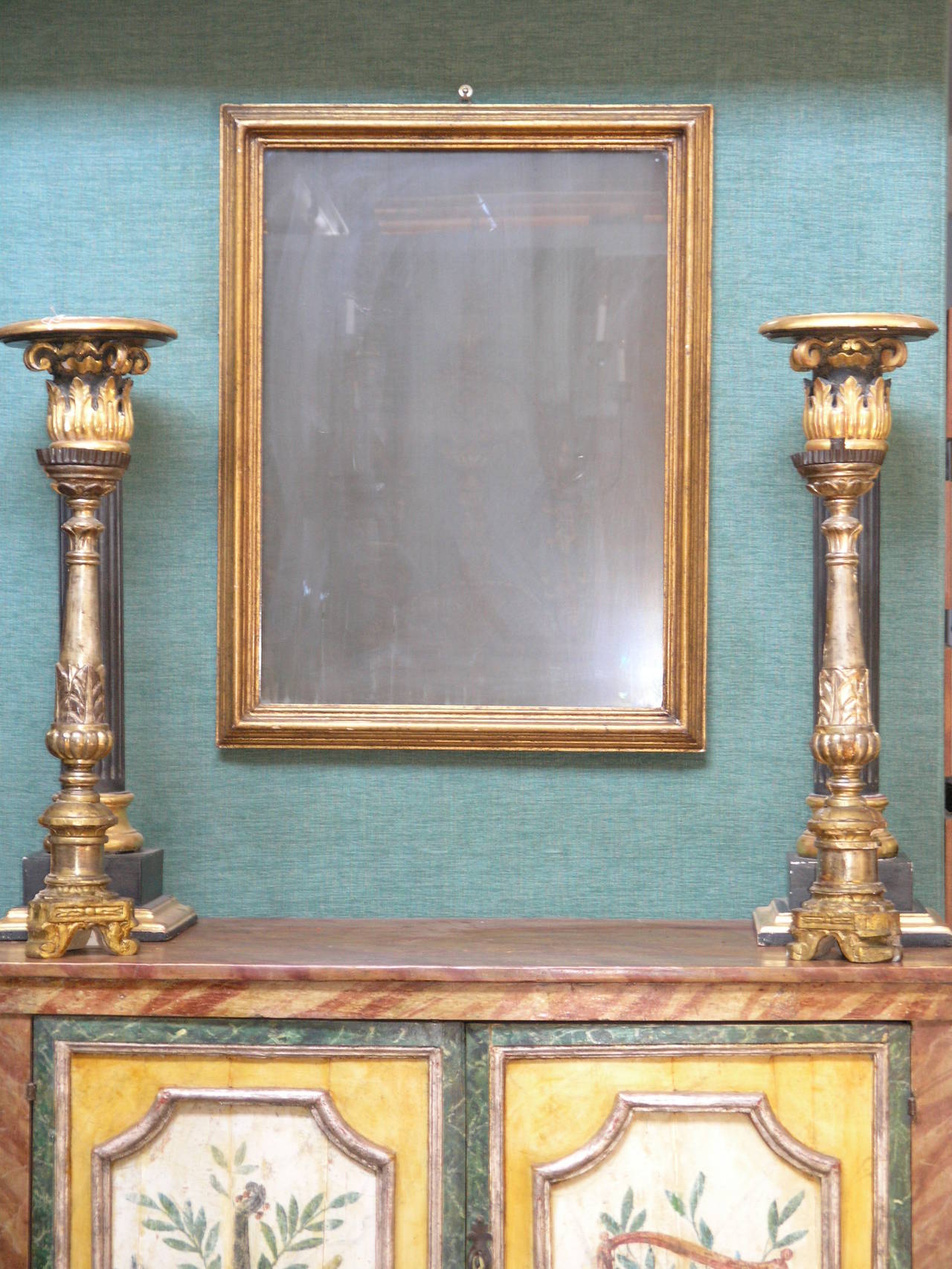 Rectangular plate within carved giltwood frame.