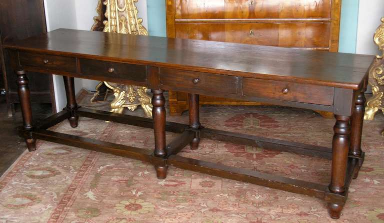 Chestnut wood Italian farm table , rectangular top raised on upright supports with stretchers , drawers on both sides