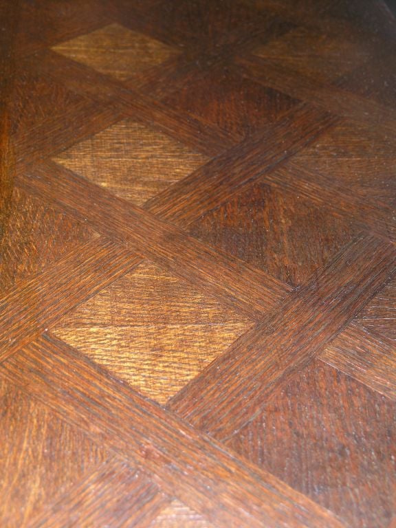 Carved oak French Breton cabinet. Rectangular marquetry top with molded edge above a paneled door opening to a shelved interior  