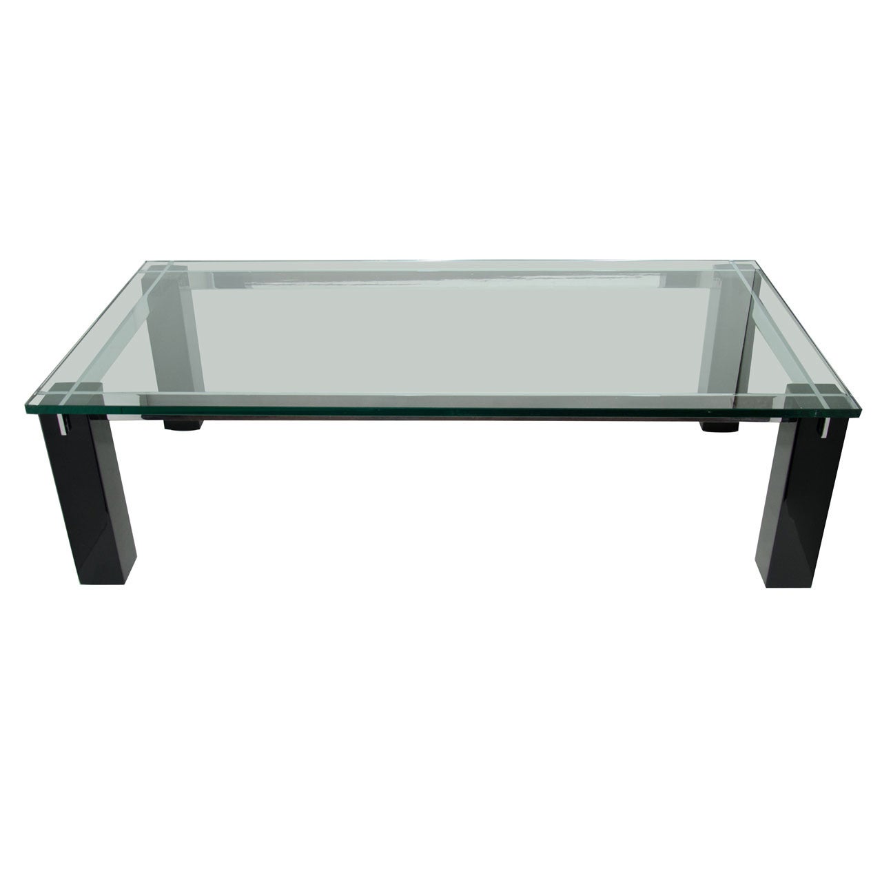 Large Mid-Century Modern coffee table with architectural design. Features heavy glass top over ebonized mahogany wood block base. Chromed steel bars are inset into the block wood legs vertically and horizontally, creating a crossbar designs.