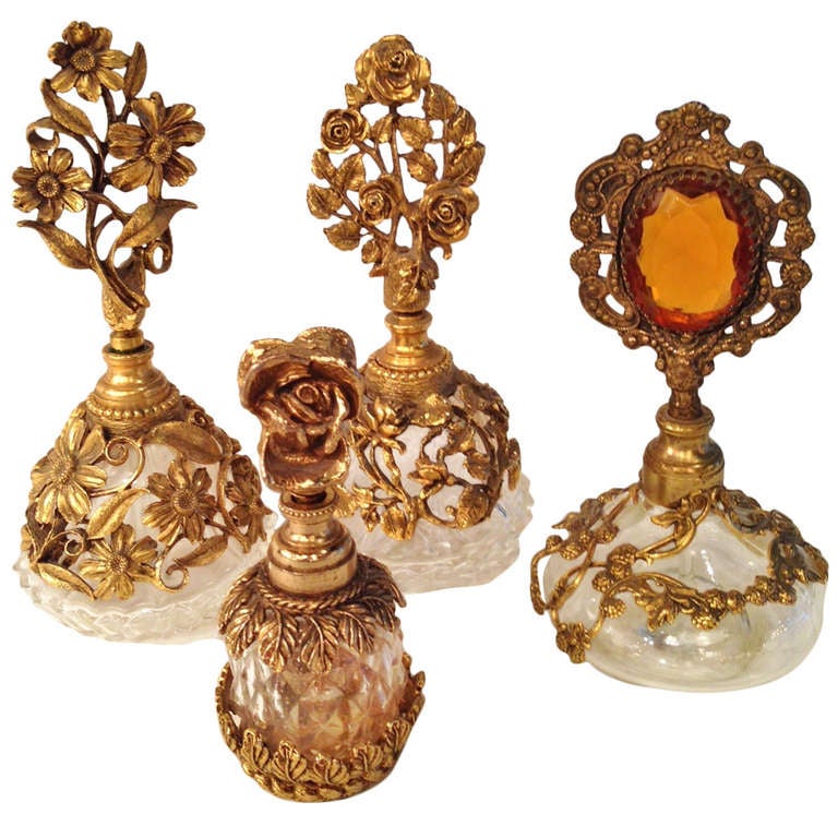 Collection of Four French Antique Perfume Bottles in Gilded Brass and