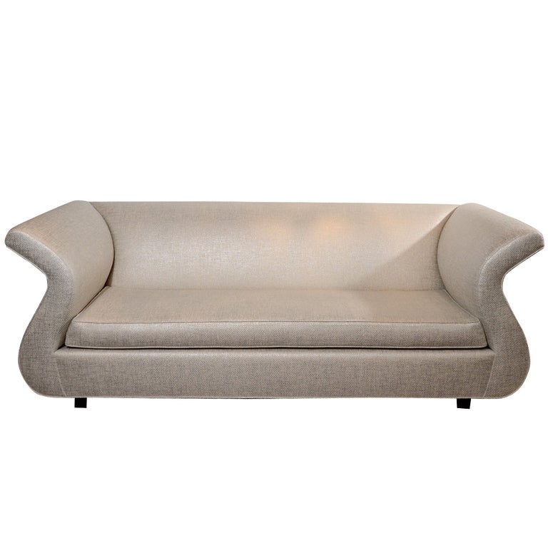 Rare Dialogica sofa designed by the late Sergio Savarese. Exceptional design features swan form with scrolled arms and sides. The shape is reminiscent of musical lyre or harps. Stunning from all angles. This sofa is currently un-upholstered.  We can