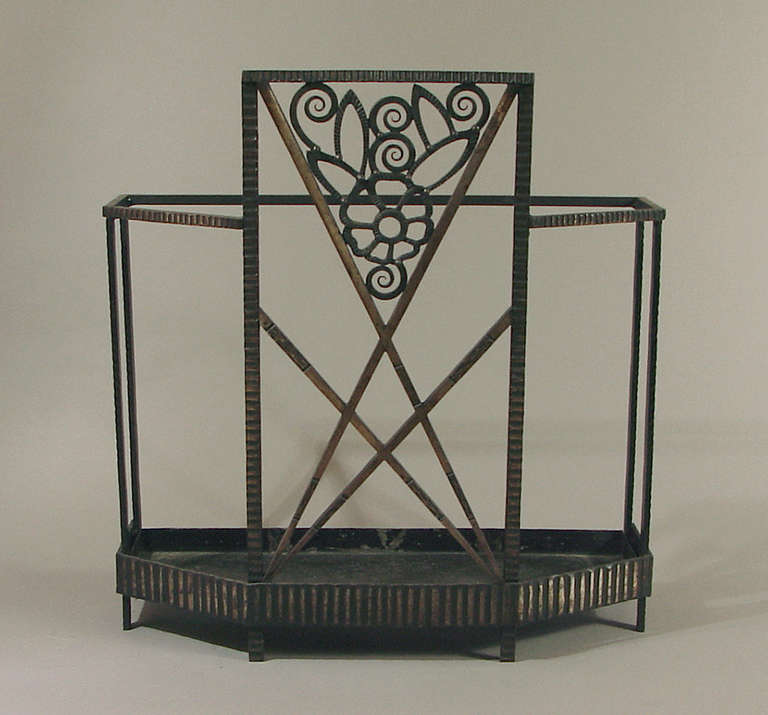 Dramatic design elements combine with classic stylized floral motifs to make this umbrella stand a piece of 