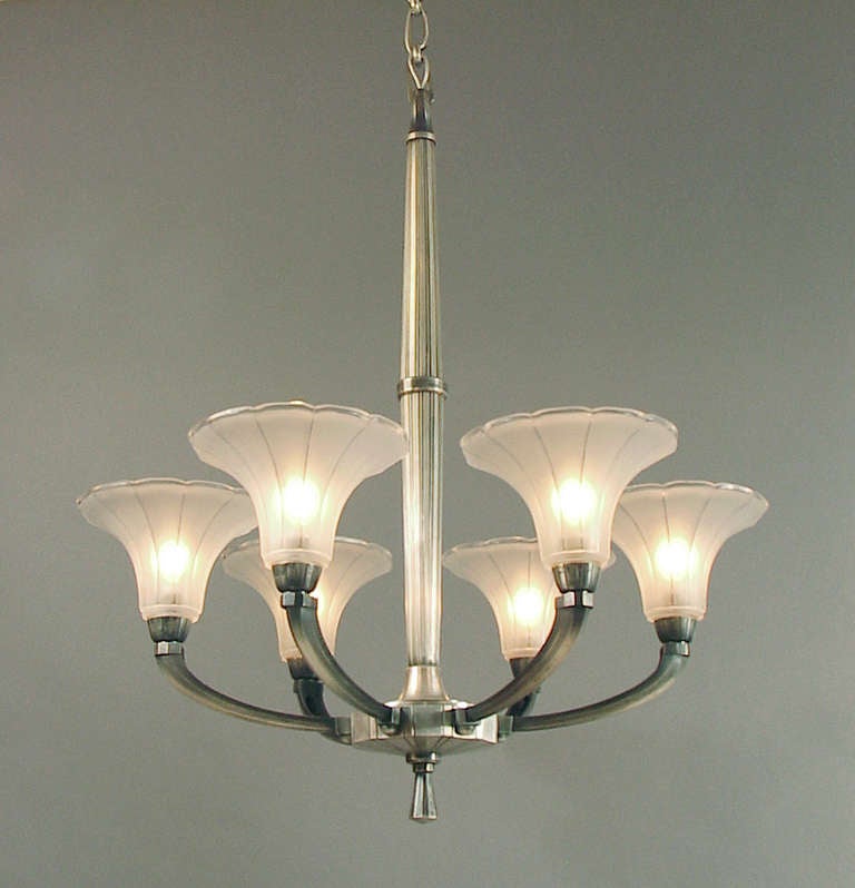 During the Art Deco period there were several manufacturers of lighting in Lyon, France, whose work showed the highest degree of design excellence and craftsmanship -- Boretti, Coduri, Maison Charles, and others I don't know about!  The metal was