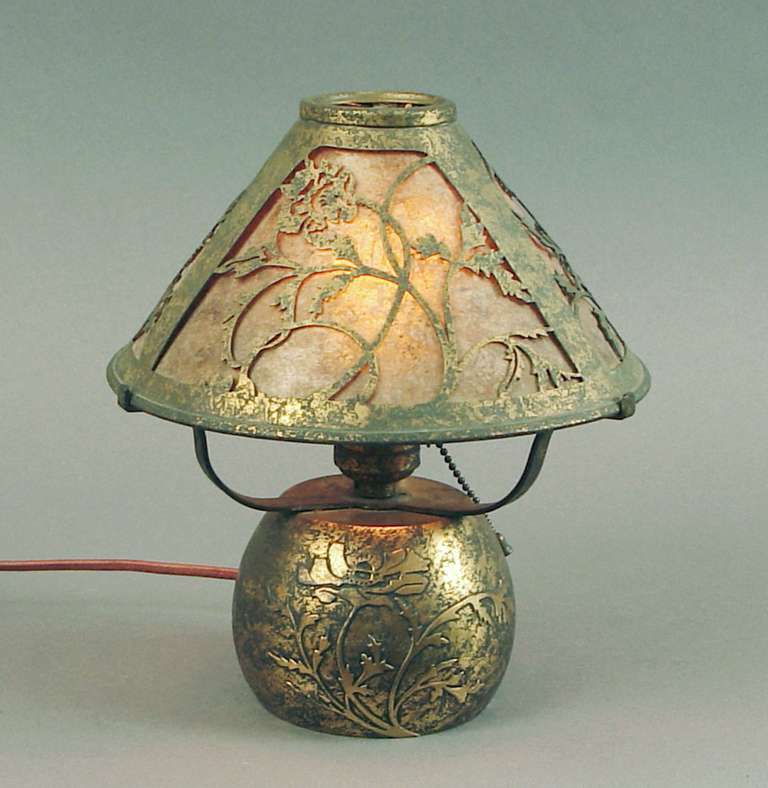 Advanced collectors know that these Silver Crest lamps originally had gathered fabric in their shade frames, and that the fabric didn't stand the test of time.  Besides disintegrating with age, it tended to gather dust.  The mica inserts that I've