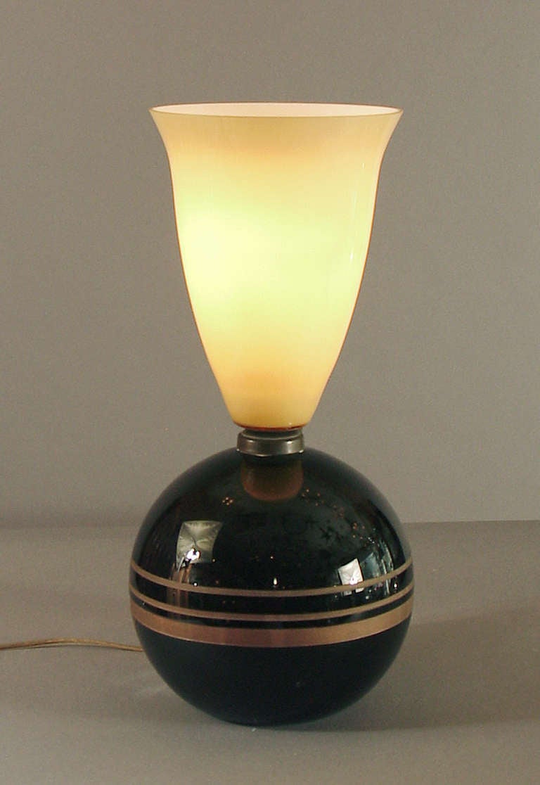 There's a certain compelling Art Deco purity about this lamp -- the black glass ball base and the slightly curvaceous 