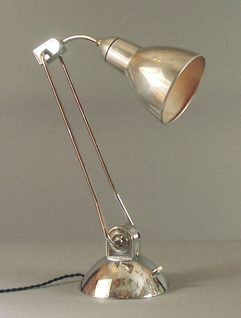 Offering a strikingly sculptural Jumo lamp, Model 610, one not around every corner!   And with looks like these, who wouldn't snap it right up?!  I might say this design is transitional between Art Deco and Art Moderne, the best of all