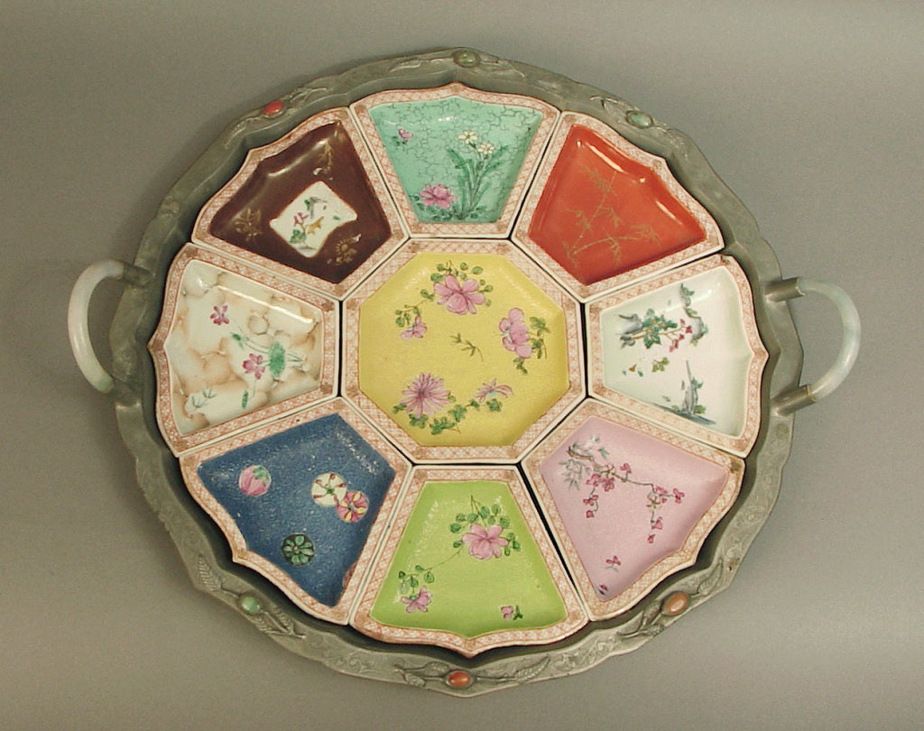This colorful sweetmeat set purportedly (I'm not an expert in Asian antiquities) hails from the 1820's or so, which was the word from a long-time dealer in Chinese antiquities.  He offered to buy it from me so that he could sell the inserts