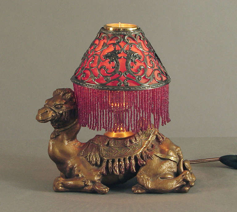 Those King Tut or otherwise Egyptian-obsessed of you will adore this camel lamp. Or, perhaps you only like the smelly, noisy and cantankerous beasts themselves. 

This one started life as an inkwell. During the Tutomania years a huge desk set was
