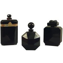 A Trio of French Art Deco Iconic Black Glass Perfume Bottles