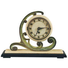 A Striking French Art Deco Table Clock of Bronze and Marble and Onyx