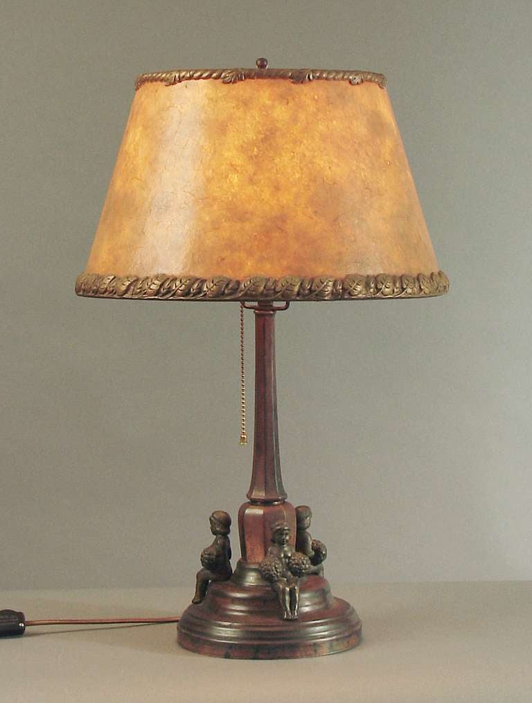 In a word, any lamp with little girls wielding pom-poms is more than OK by me!

This constitutes a happy marriage, of course, between an Austrian lamp base and an American mica shade from the same period (Ca. 1910).  Why the Europeans didn't ever