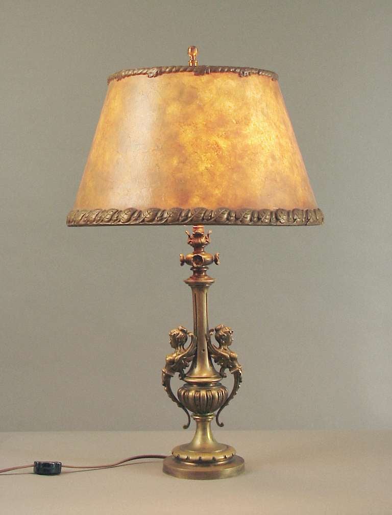 This constitutes a happy marriage between a French lamp base and an American mica shade from the same period (Ca. 1910).  Why the French didn't ever make mica shades is entirely beyond me, as they are doubtless one of America's top esthetic