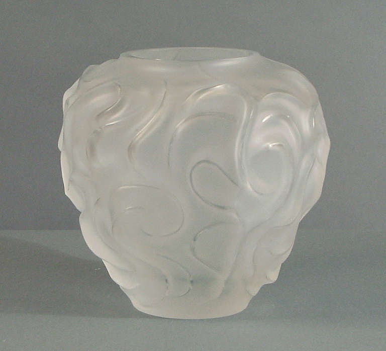 True to form this French vase is exquisitely designed and manufactured, if one may use such crass terms when describing ART.  There's major quality here in the finish: delicately acid-etched with the prominent highlights in clear.  This vase weighs
