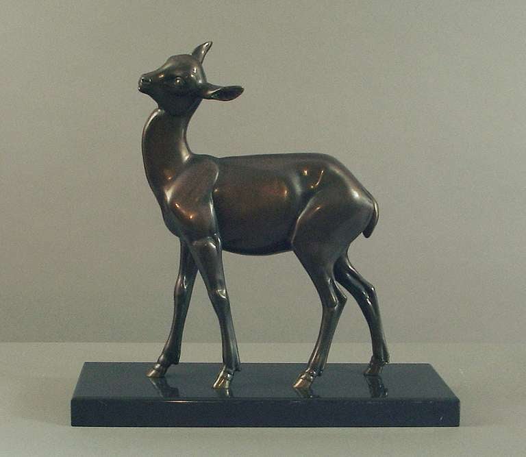Born in France in 1906, Irénée Rochard became one of France's most celebrated sculptors of the animal kingdom, certainly of the 20th Century. This signed (on the black Belgian marble base) statue of a wary fawn is compelling in its animation and