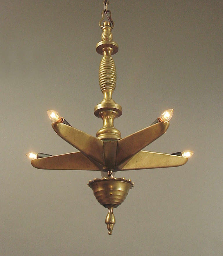 Purchased in France, possibly from France or some other Mediterranean country; I was told that it might be at home in a synagogue.  Top quality brass castings, simple and elegant geometric designs.  Five lights, outfitted with American candelabra
