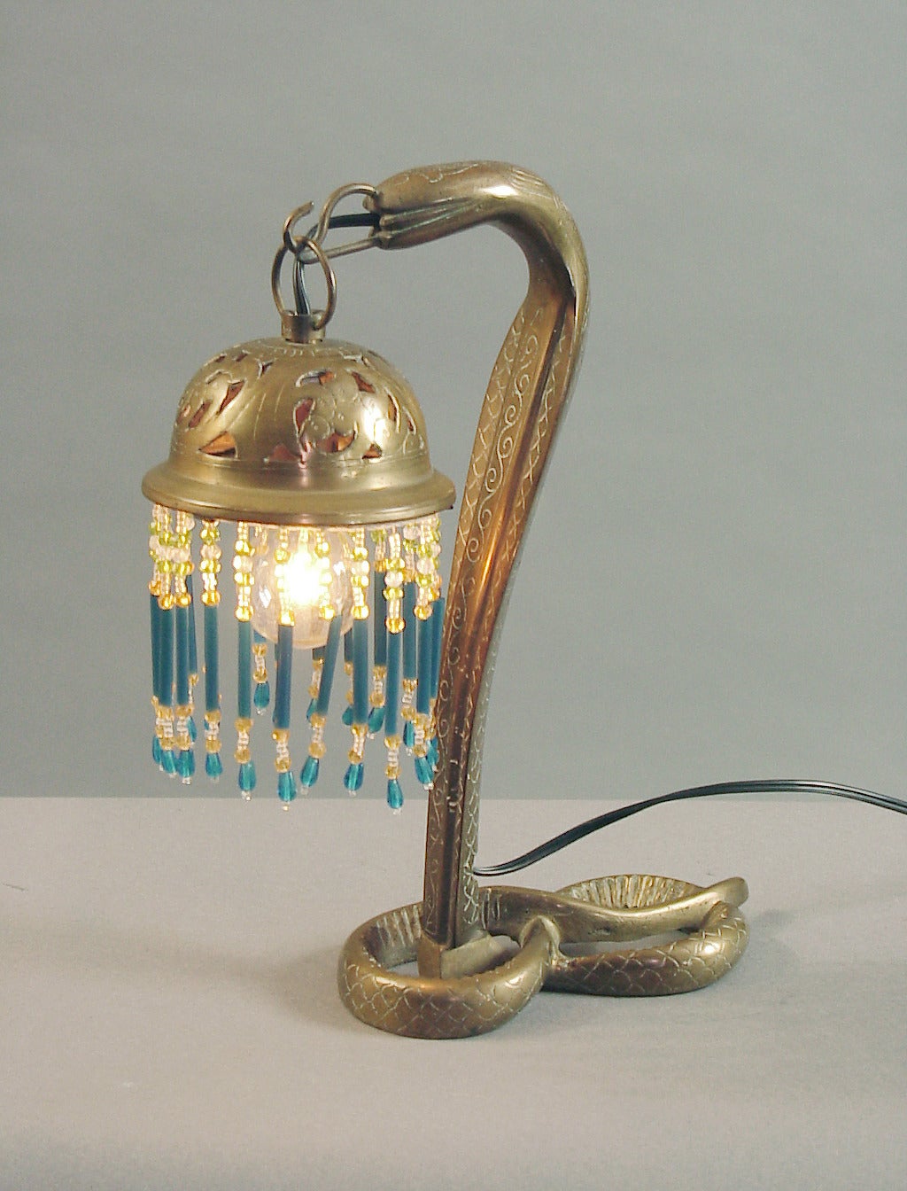 Syrians made a full compliment of brass lamps which were decorated by hand and ornamented with glass beaded shades, and sold all over the world. Over the years I've had table lamps and floor lamps; they're always beautifully designed and executed,