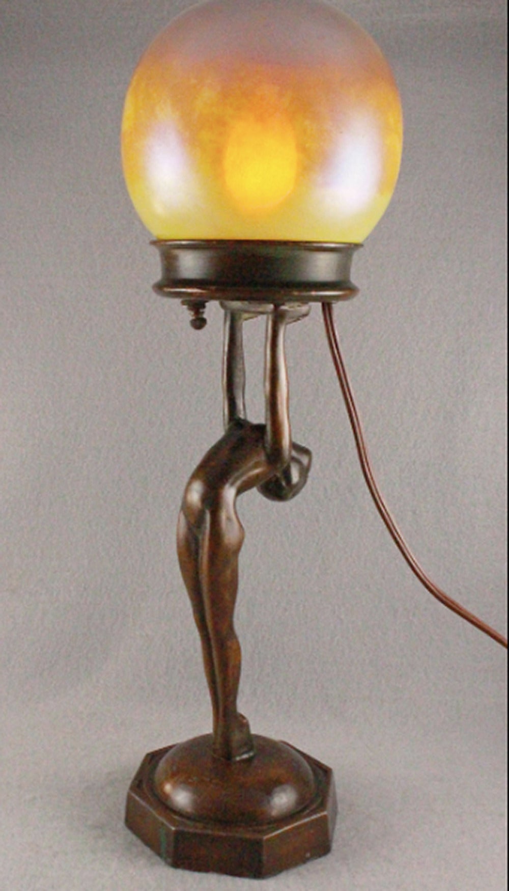 Wow, and hubba-hubba, how much better does it get than this?  The obvious answer: NOT.  Original bronze patina, exquisite blown shade, opalescent and cased glass, with an iridescent finish reminiscent of glass masters such as Tiffany and Quezal! 