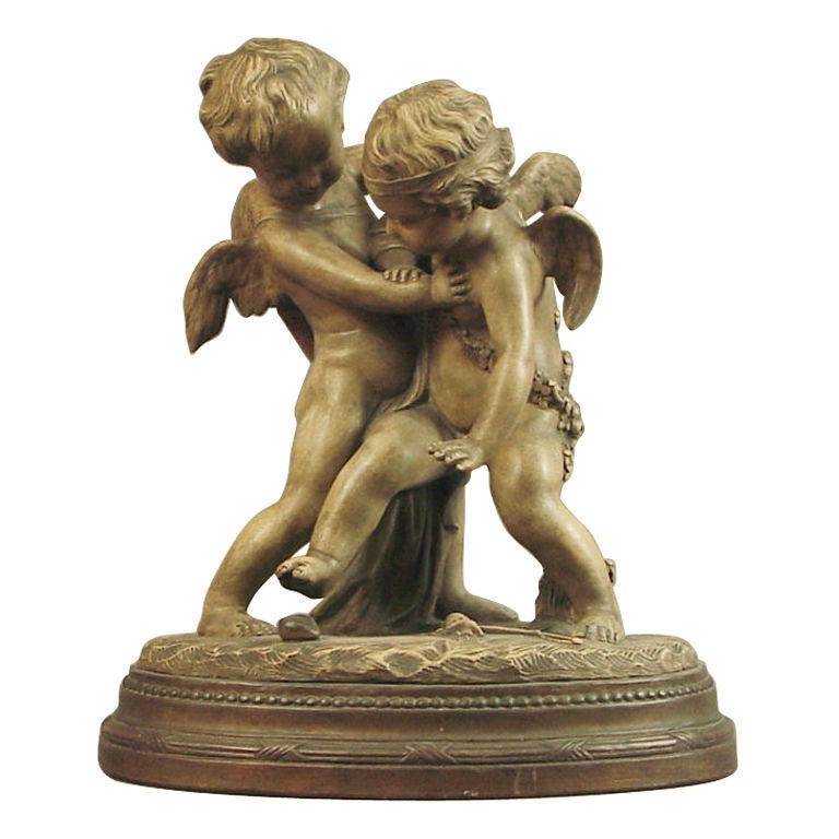Signed Falconnet, this large French terra cotta sculpture depicts two animated, cute and pudgy cupids struggling over what appears to be a fallen (i.e., available) heart.  The patina is in excellent condition as is the sculpture itself.