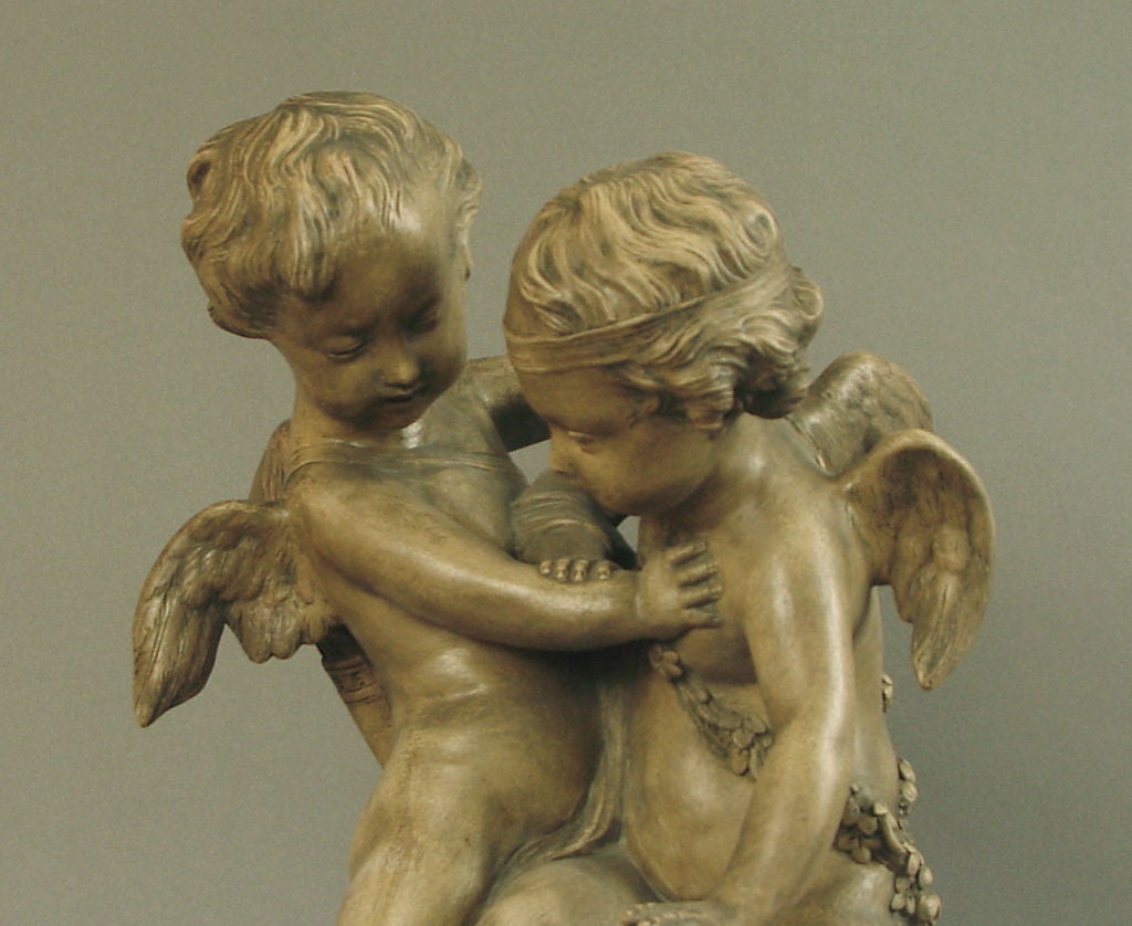 Patinated French Terra Cotta Statue of Cupids/Putti Tussling over a Heart For Sale