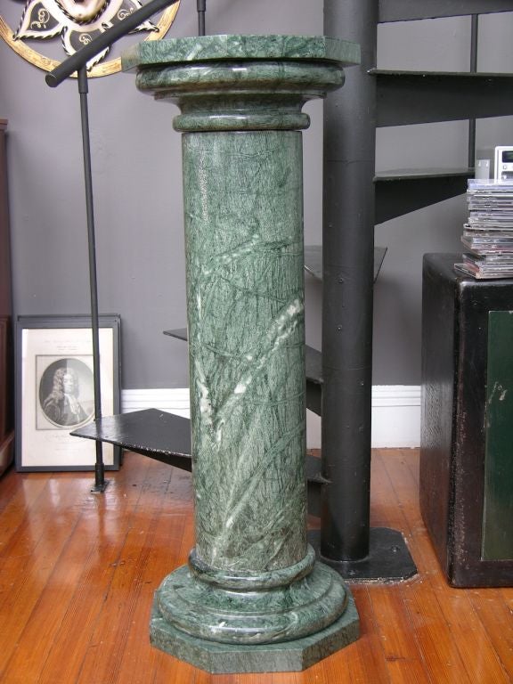 Italian pair of marble columns pedestals in an amazing veined green Verde Guatemala marble, custom made in three parts and hand-turned with octagonal top and base. 
Each column available individually at $2400.