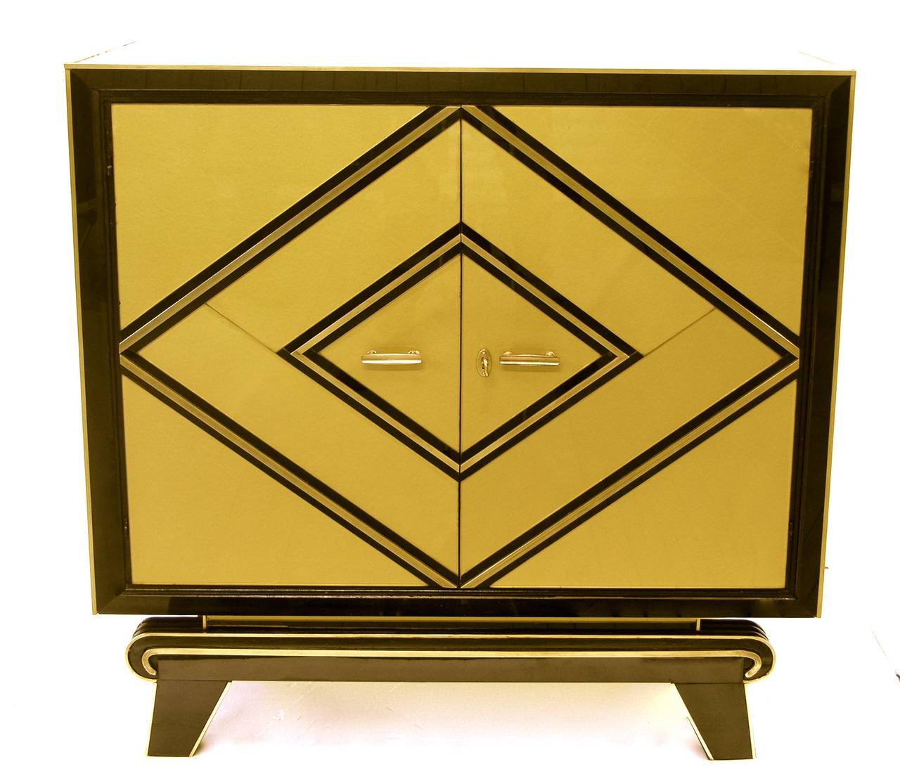 Custom-made Italian design cabinet, the surround in very chic opaline black glass with unique pure gold glass front decoration highlighted with handcrafted deep bronze inserts and handmade concave brass handles, raised on very unusual and unique