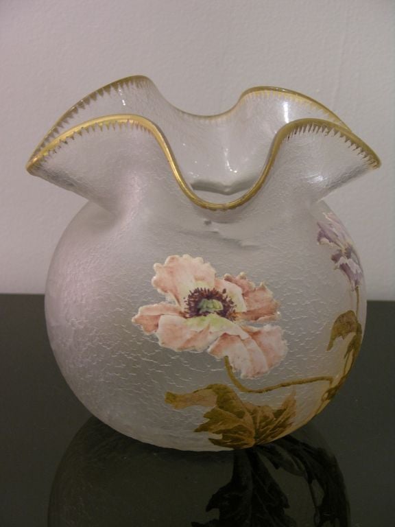 Very elegant and chic glass vase, Work of Art by the French glass maker Legras,  with the sought-after shape as an alms purse, the textured glass is hand enameled with flowers in high-quality cameo relief and gilded leaves, the rounded edge trimmed