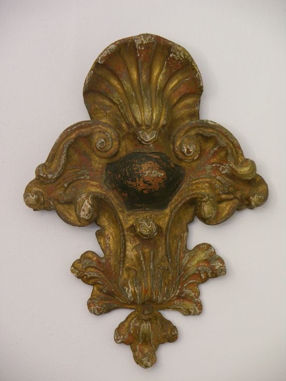 Exquisite pair of Rococo wall decorations in polychrome hand-carved wood, hand-painted and gilt, with shell-shaped top, a great decorating touch for the top or the sides of a door or archway. Original condition with parts of paint and gilding