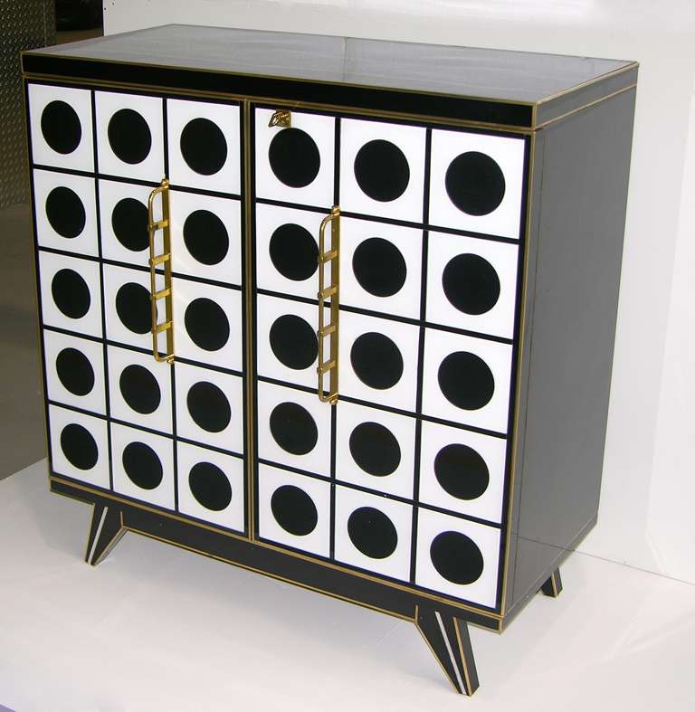 These cabinets/sideboards speak highly of Italian Design! The perfection of the execution in glass is extraordinary with a pattern of black rounds on white squares outlined with incredible precision that give an Art Deco look, quality of details for