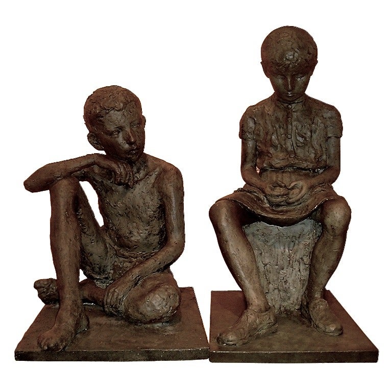 France, early 20th century.
Pair of two lifesize sculptures, brother and sister, the boy sitting cross-legged and the girl on a stump holding a play ball in her hands. 
This work of art is in plaster and distinguished by a high quality rare finish