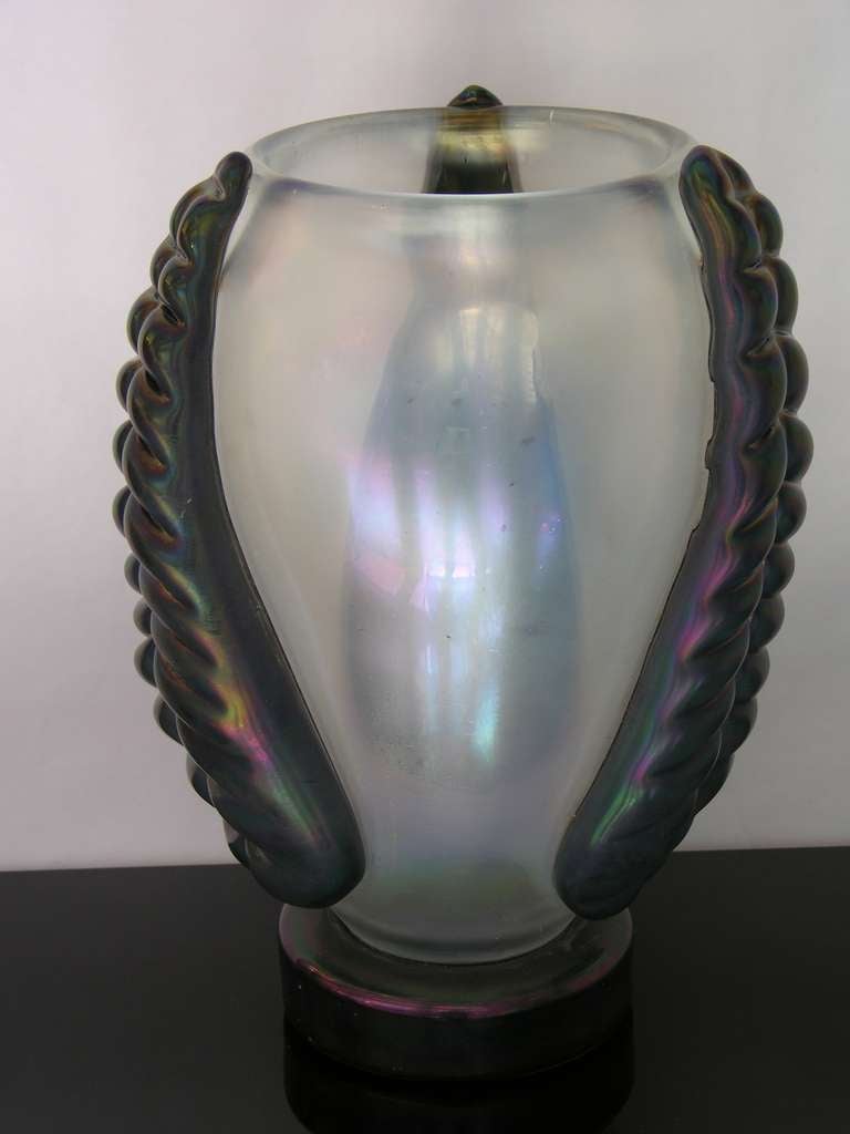 Blown Murano glass vases, signed by Costantini on the bottom, the glass worked with a lovely pearly iridescence and the relief side decorations in hand crafted black iridescent glass.