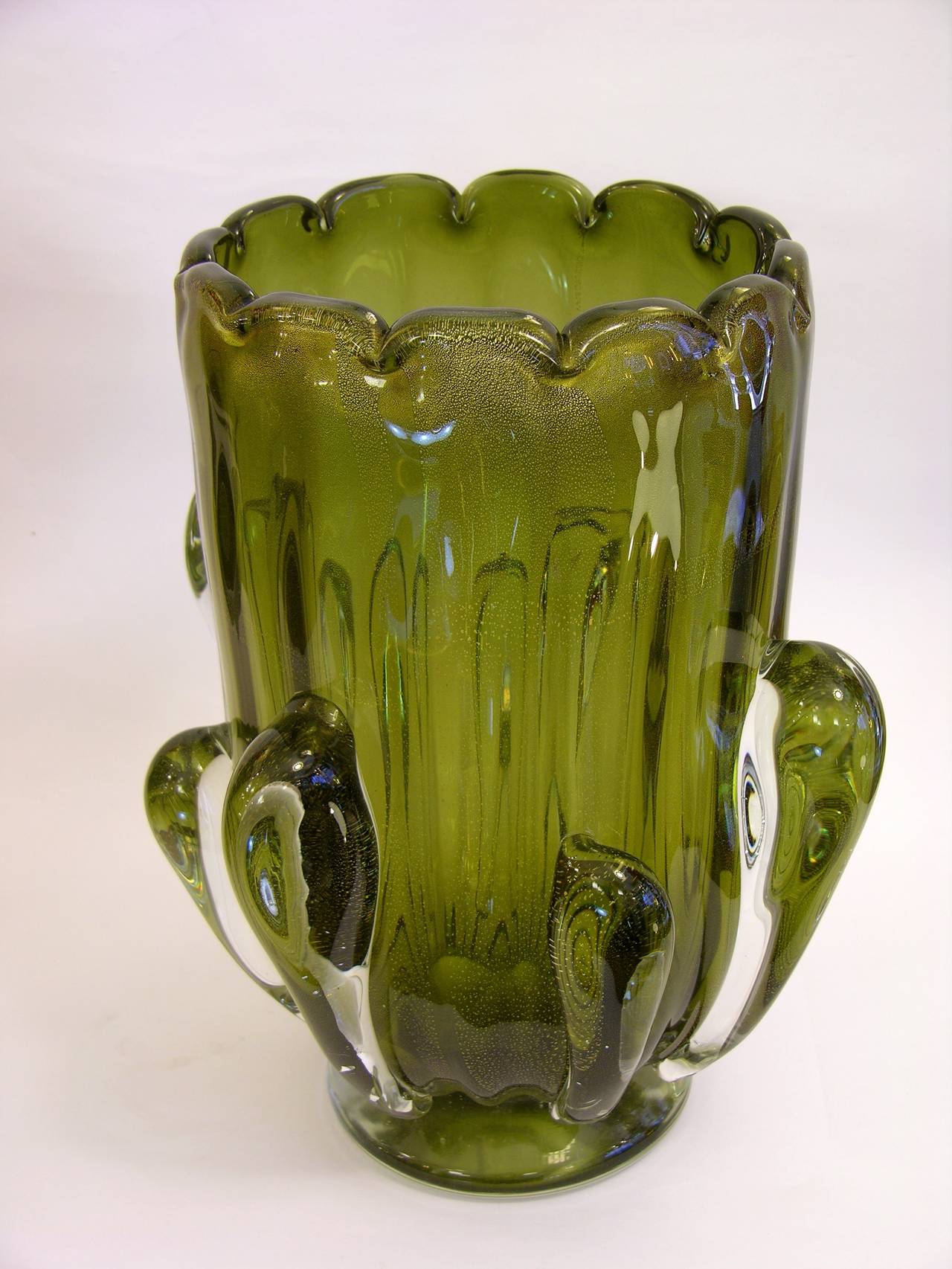 Italian Pair of vases in very high quality overlaid Murano glass, in a very elegant and unusual shade of olive green, worked with pure 24kt gold in the glass that adds glow and preciousness, the bodies with scalloped edges nicely decorated with