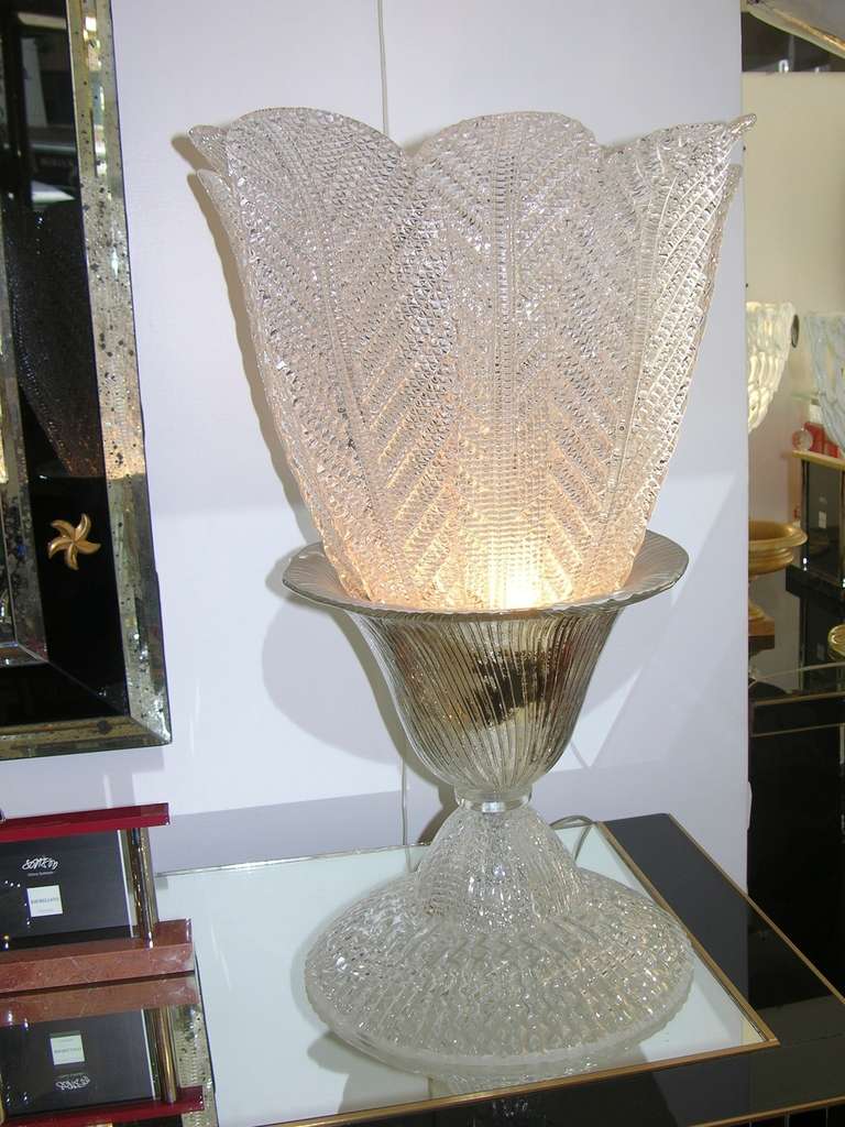 One of a kind 1970's pair of Italian design lamps that are very unique by Seguso Vetri d'Arte. The quality and the texture of the glass are amazing.  The ribbed central bowl worked with mirrored silver contains diamond textured glass leaves that