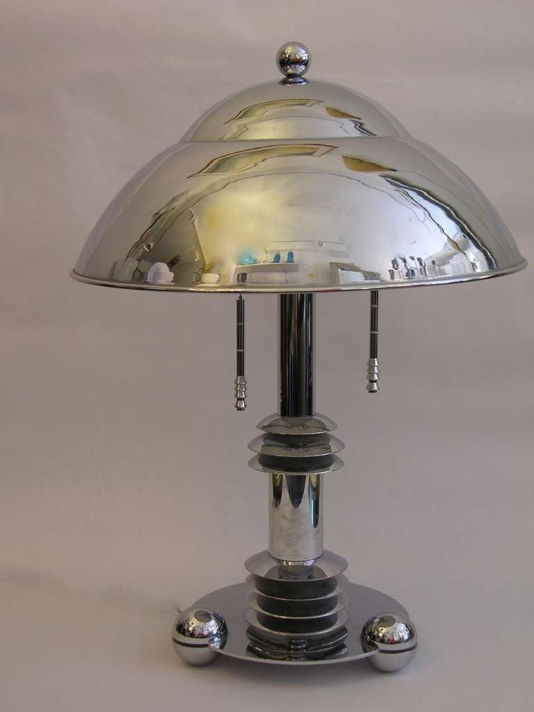 Very high-tech design for this rare pair of vintage chromed lamps designed by Jay Spectre for Paul Hanson, with Machine Age inspiration, chromed metal shades with white lacquered inside to reflect the light more efficiently and two settings of light
