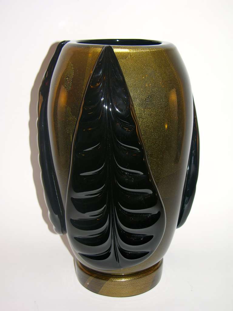 Vintage Italian pair of high quality Art Deco Design Murano glass vases by Pino Signoretto, signed pieces. Exquisite craftsmanship: the blown bodies in black Murano glass are worked with expanded pure gold that makes them glow, decorated in relief
