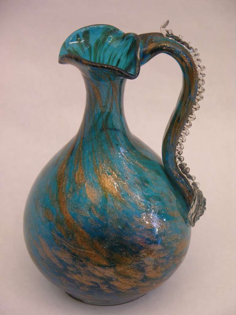 Old Venetian Murano glass pitcher from the 1940s, magnificent sea blue colored glass extensively decorated with avventurina metallic copper flakes in the glass. This piece shows not only a high quality of execution but also a sophisticated design