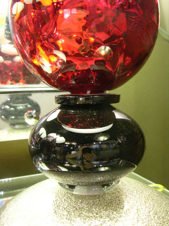 Italian pair of quality Venetian lamps, c.1970, in black Murano glass and red mercury mirrored ball, on a very attractive base worked with silver and the difficult technique 
