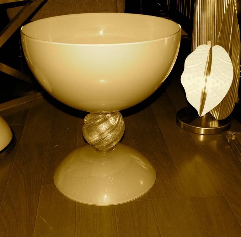 A striking pair of monumental bowls or centerpieces in blown Murano glass, work of art signed by Alberto Dona', a superb work with three glass overlays, the exterior in a refined ivory color extensively enriched with expanded pure gold leaf, raised