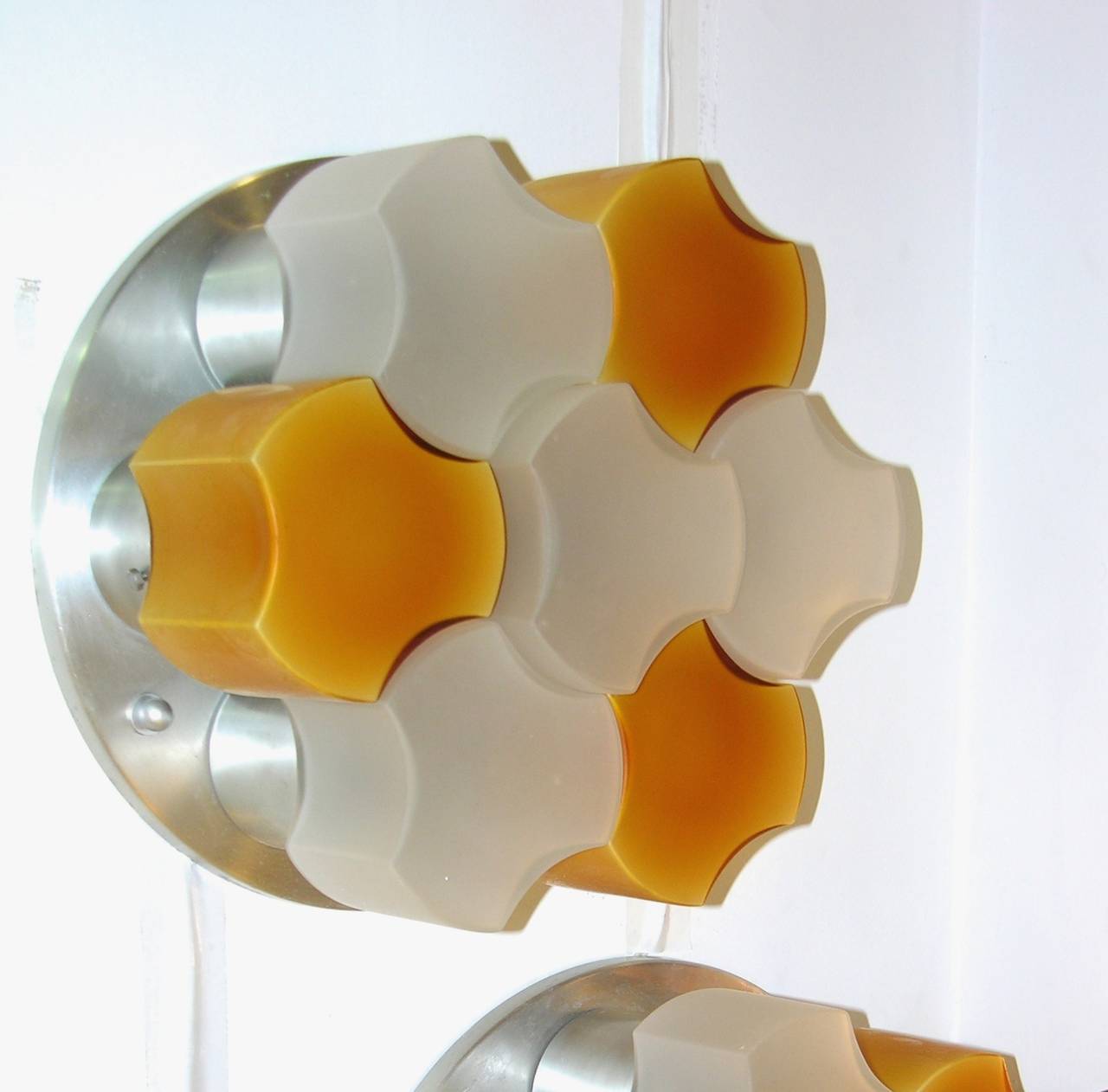 A very rare Italian pair of lights by Martinelli Luce, 1963, characterized by an essential Art Design and inventiveness, two prominent elements of Martinelli Luce philosophy. These highly decorative yet very functional lights (that can be used on